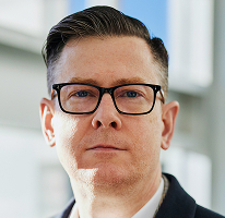 Portrét vedoucího pracovníka Alexander Hughes, generálního ředitele společnosti zabývající se kryptoměnovým obchodováním